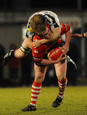 12.03.10 - Principality Premiership Rugby, Swansea v Pontypridd Ponty\s Kristian Dacey takes Swansea's Luke Jones for a ride 