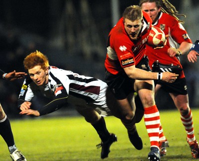 12.03.10 - Principality Premiership Rugby, Swansea v Pontypridd Ponty's Chris Clayton shrugs off Swansea's James Dixon on his way to score a try 