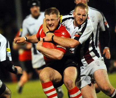 12.03.10 - Principality Premiership Rugby, Swansea v Pontypridd Ponty's Chris Clayton is tackled by Marc Popham 