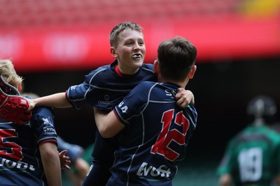 210324 - Swansea Valley v Mynydd Mawr - Welsh Schools Junior Group U11 DC Thomas Bowl Final - Mynydd Mawr celebrate at the final whistle  