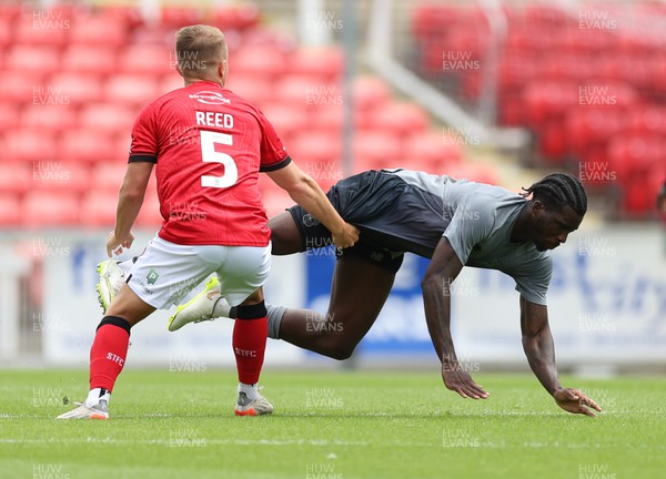 230722 - Swindon Town v Cardiff City, Pre-season Friendly - Sheyi Ojo of Cardiff City is challenged by Louis Reed of Swindon Town
