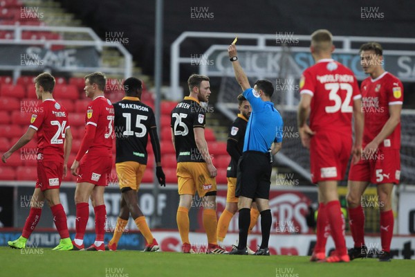 081218 - Swindon Town v Newport County, Sky Bet League 2 - Referee Dean Whitestone shows the yellow card to Mark O'Brien of Newport County