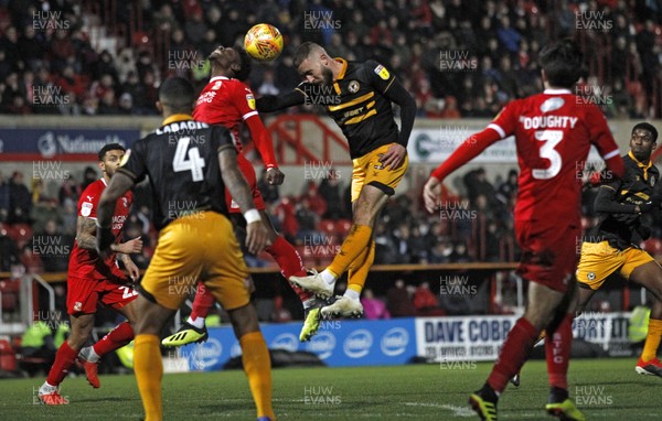 081218 - Swindon Town v Newport County, Sky Bet League 2 - Dan Butler of Newport County (centre) gets up to head the ball