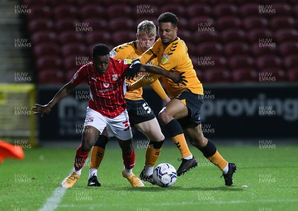 091121 - Swindon Town v Newport County, EFL Papa John's Trophy - Jermaine Hylton of Newport County and Mohammad Dabre of Swindon Town compete for the ball