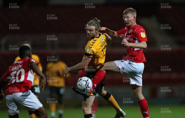 091121 - Swindon Town v Newport County, EFL Papa John's Trophy - Alex Fisher of Newport County and Callum Winchcombe of Swindon Town compete for the ball