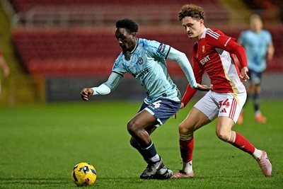 110226 - Swindon Town v Newport County - Sky Bet League 2 - Nathan Opoku of Newport County is challenged by Billy Kirkman of Swindon