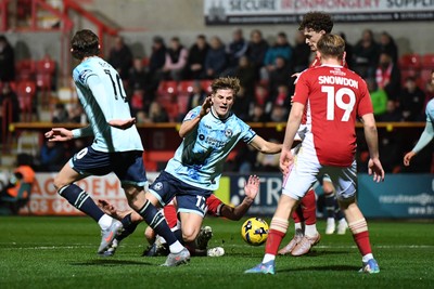 110226 - Swindon Town v Newport County - Sky Bet League 2 - Tom Davies of Newport County is tackled on the edge of the box