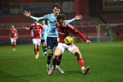 110226 - Swindon Town v Newport County - Sky Bet League 2 - Michael Spellman of Newport County is challenged by Billy Kirkman of Swindon