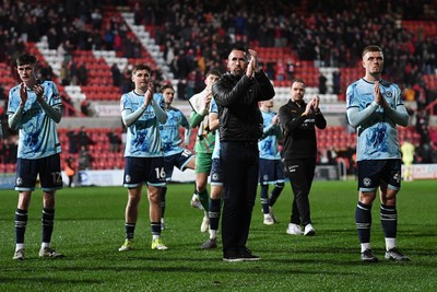110226 - Swindon Town v Newport County - Sky Bet League 2 - Newport County Head Coach, Christian Fuchs and his players at full time