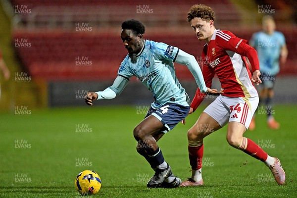 110226 - Swindon Town v Newport County - Sky Bet League 2 - Nathan Opoku of Newport County is challenged by Billy Kirkman of Swindon