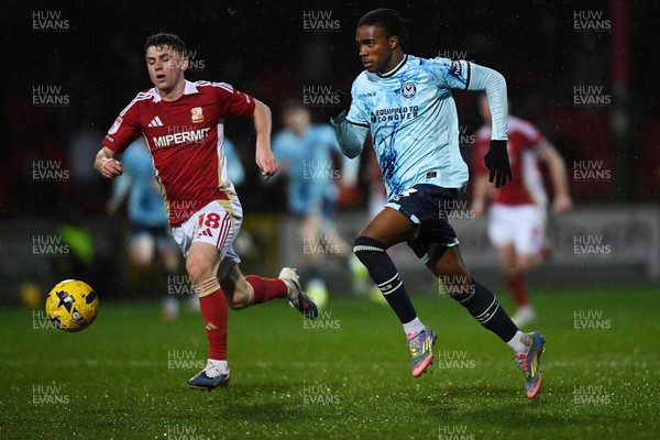 110226 - Swindon Town v Newport County - Sky Bet League 2 - Tanatswa Nyakuhwa of Newport County is challenged by Gavin Kilkenny of Swindon
