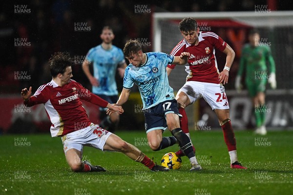 110226 - Swindon Town v Newport County - Sky Bet League 2 - Tom Davies of Newport County is challenged by Joel McGregor of Swindon