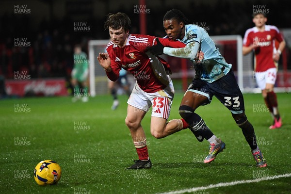 110226 - Swindon Town v Newport County - Sky Bet League 2 - Tanatswa Nyakuhwa of Newport County is challenged by Joel McGregor of Swindon