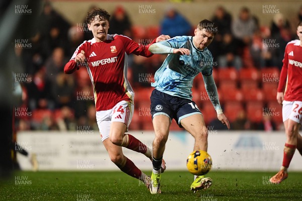 110226 - Swindon Town v Newport County - Sky Bet League 2 - James Crole of Newport County is challenged by Billy Kirkman of Swindon