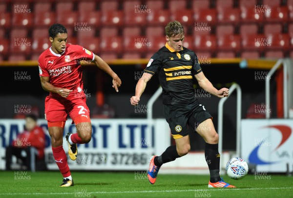 110918 - Swindon Town v Newport County - Checkatrade Trophy - Cameron Pring of Newport County tries to get past Kyle Knoyle of Swindon Town