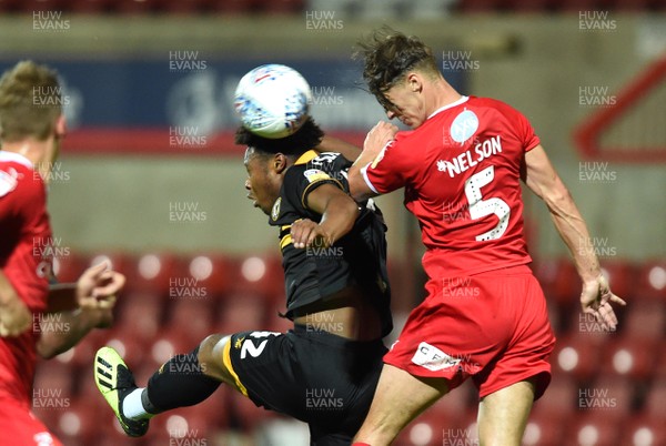 110918 - Swindon Town v Newport County - Checkatrade Trophy - Antoine Semenyo of Newport County and Sid Nelson of Swindon Town compete