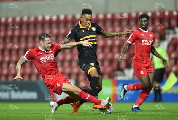 110918 - Swindon Town v Newport County - Checkatrade Trophy - Keanu Marsh-Brown of Newport County is tackled by James Dunne of Swindon Town