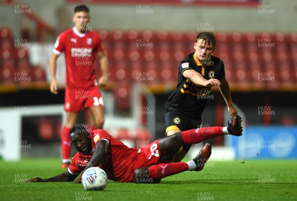 110918 - Swindon Town v Newport County - Checkatrade Trophy - Cameron Pring of Newport County is tackled by Toumani Diagouraga of Swindon Town