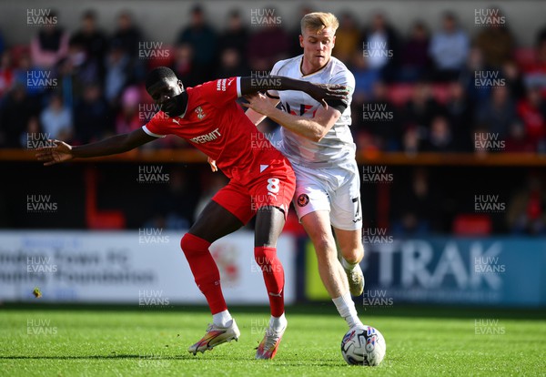 141023 - Swindon Town v Newport County - EFL SkyBet League 2 - Saidou Khan of Swindon Town is tackled by Will Evans of Newport County
