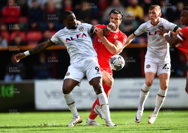 141023 - Swindon Town v Newport County - EFL SkyBet League 2 - Omar Bogle of Newport County is tackled by Tom Brewitt of Swindon Town