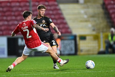 220926 - Swindon Town v Newport County - EFL Trophy -  Cameron Evans of Newport County is challenged by Mitchell Clark of Swindon
