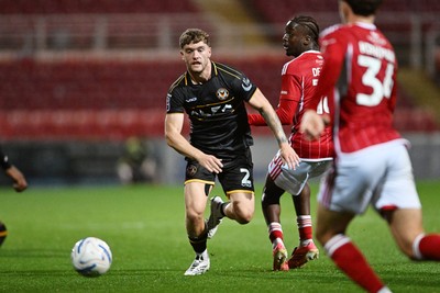 220926 - Swindon Town v Newport County - EFL Trophy -  Cameron Evans of Newport County is challenged by James Debayo of Swindon