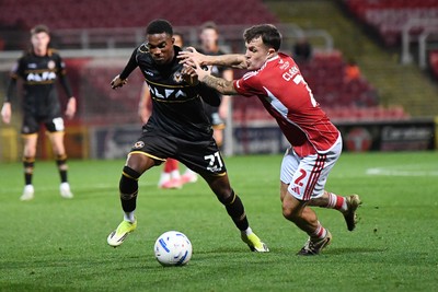 220926 - Swindon Town v Newport County - EFL Trophy -  Tanatswa Nyakuhwa of Newport County is challenged by Tom Nichols of Swindon