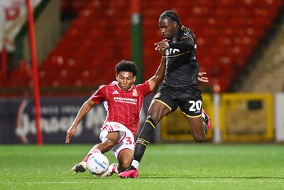 220926 - Swindon Town v Newport County - EFL Trophy -  Yahya Bamba of Newport County is challenged by Lucas Griffiths-Brown of Swindon