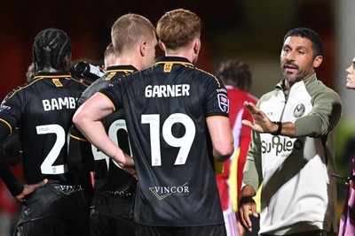 220926 - Swindon Town v Newport County - EFL Trophy -  Newport County Head Coach, Hayden Mullins speaks to his players during a water break