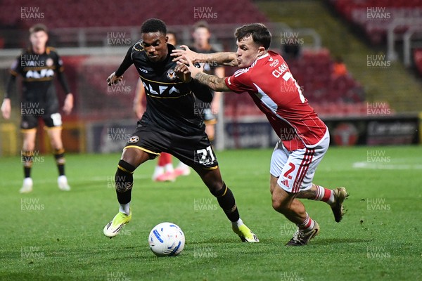 220926 - Swindon Town v Newport County - EFL Trophy -  Tanatswa Nyakuhwa of Newport County is challenged by Tom Nichols of Swindon