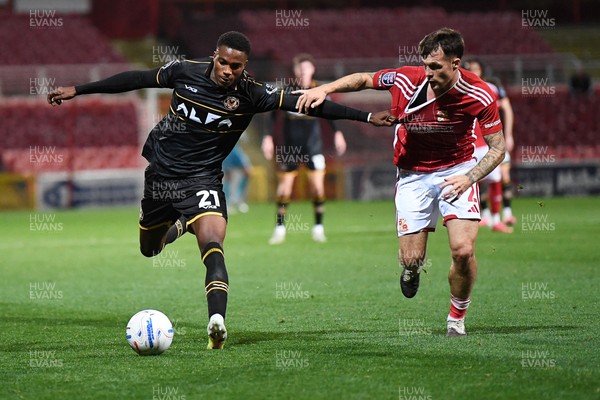 220926 - Swindon Town v Newport County - EFL Trophy -  Tanatswa Nyakuhwa of Newport County is challenged by Jaylan Pearman of Swindon
