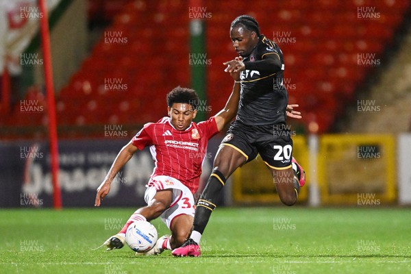 220926 - Swindon Town v Newport County - EFL Trophy -  Yahya Bamba of Newport County is challenged by Lucas Griffiths-Brown of Swindon