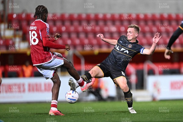 220926 - Swindon Town v Newport County - EFL Trophy -  Matt Smith of Newport County is challenged by James Debayo of Swindon