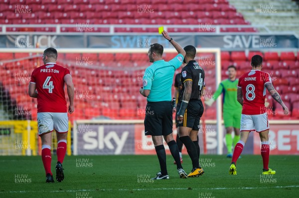 251117 - Swindon Town v Newport County - Sky Bet League 2 - Newport County midfielder Joss Labadie (4) is given a yellow card by referee James Linington