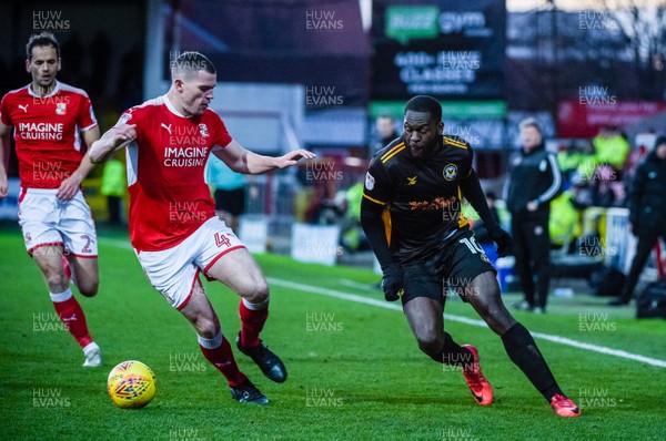 251117 - Swindon Town v Newport County - Sky Bet League 2 - Swindon Town defender Matt Preston (4) and Newport County forward Frank Nouble (10) challenge for a loose ball