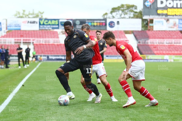 280919 - Swindon Town v Newport County - EFL SkyBet League 2 - Jamille Matt of Newport County takes on Jerry Rates and Rob Hunt of Swindon Town