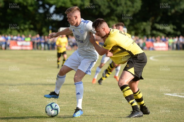 130718 - Taff's Well v Cardiff City - Preseason Friendly - Rhys Healey of Cardiff City is tackled by Matty James of Taff's Well