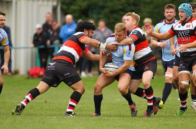 081016 Tata Steel RFC v Pontypool RFC - SWALEC Championship -Bleddyn Davies of Tata Steel is tackled by Sione Tuipolotu(L) and Matthew Jones of Pontypool