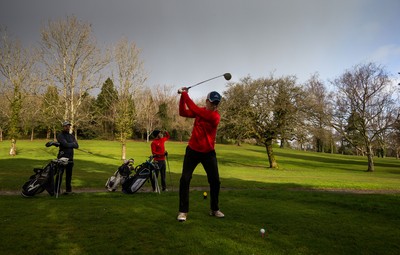 130321 Golf returns in Wales - One of the first players to take to the course plays a shot at Cardiff Golf Club on the day that lockdown restrictions were eased in Wales for outside sports including golf and tennis
