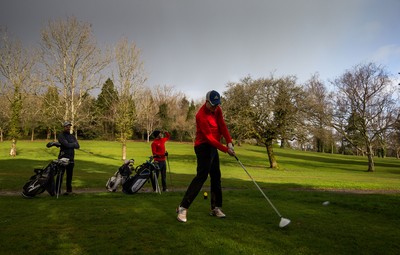 130321 Golf returns in Wales - One of the first players to take to the course plays a shot at Cardiff Golf Club on the day that lockdown restrictions were eased in Wales for outside sports including golf and tennis