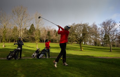 130321 Golf returns in Wales - One of the first players to take to the course plays a shot at Cardiff Golf Club on the day that lockdown restrictions were eased in Wales for outside sports including golf and tennis
