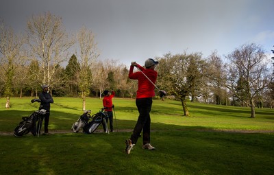 130321 Golf returns in Wales - One of the first players to take to the course plays a shot at Cardiff Golf Club on the day that lockdown restrictions were eased in Wales for outside sports including golf and tennis