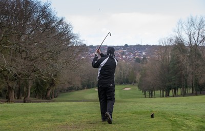 130321 Golf returns in Wales - One of the first players to take to the course plays a shot at Cardiff Golf Club on the day that lockdown restrictions were eased in Wales for outside sports including golf and tennis