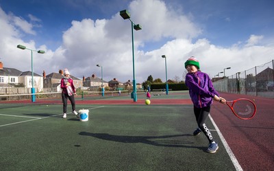 130321 Golf and Tennis return in Wales - Sara Davies, aged 10 from Cardiff, has her first tennis lesson in over 3 months from Head Coach Melissa Davies at Whitchurch Tennis Club in Cardiff on the day that lockdown restrictions were eased in Wales for outside sports including golf and tennis
