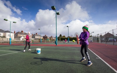 130321 Golf and Tennis return in Wales - Sara Davies, aged 10 from Cardiff, has her first tennis lesson in over 3 months from Head Coach Melissa Davies at Whitchurch Tennis Club in Cardiff on the day that lockdown restrictions were eased in Wales for outside sports including golf and tennis