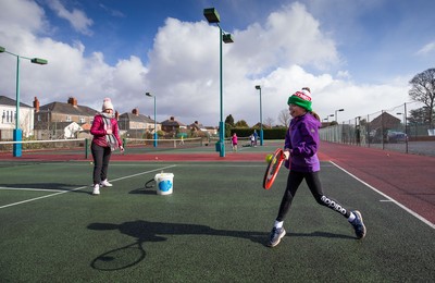 130321 Golf and Tennis return in Wales - Sara Davies, aged 10 from Cardiff, has her first tennis lesson in over 3 months from Head Coach Melissa Davies at Whitchurch Tennis Club in Cardiff on the day that lockdown restrictions were eased in Wales for outside sports including golf and tennis