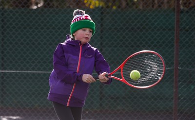 130321 Golf and Tennis return in Wales - Sara Davies, aged 10 from Cardiff, has her first tennis lesson in over 3 months from Head Coach Melissa Davies at Whitchurch Tennis Club in Cardiff on the day that lockdown restrictions were eased in Wales for outside sports including golf and tennis