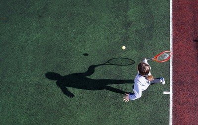 130321 Golf and Tennis return in Wales - Sara Davies, aged 10 from Cardiff, has her first tennis lesson in over 3 months from Head Coach Melissa Davies at Whitchurch Tennis Club in Cardiff on the day that lockdown restrictions were eased in Wales for outside sports including golf and tennis