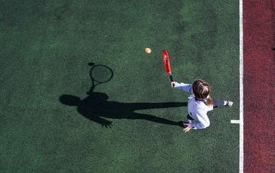130321 Golf and Tennis return in Wales - Sara Davies, aged 10 from Cardiff, has her first tennis lesson in over 3 months from Head Coach Melissa Davies at Whitchurch Tennis Club in Cardiff on the day that lockdown restrictions were eased in Wales for outside sports including golf and tennis