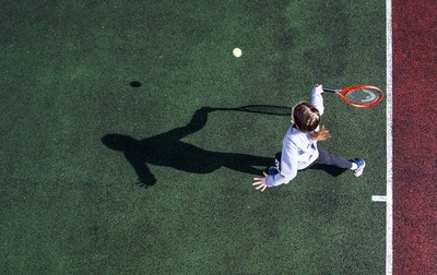 130321 Golf and Tennis return in Wales - Sara Davies, aged 10 from Cardiff, has her first tennis lesson in over 3 months from Head Coach Melissa Davies at Whitchurch Tennis Club in Cardiff on the day that lockdown restrictions were eased in Wales for outside sports including golf and tennis